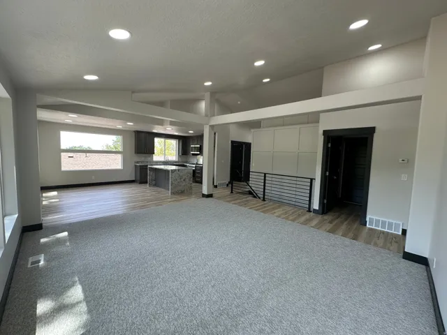 Recessed lighting and a vaulted ceiling complement the open-concept design