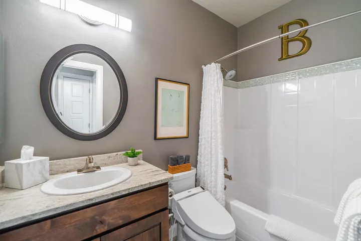 Vanity with integrated sink and stone-finish countertop