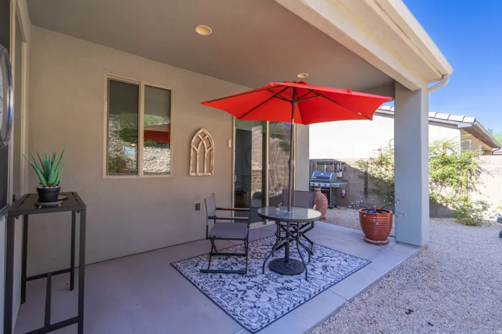 Covered patio with recessed lighting, stucco exterior, and concrete flooring