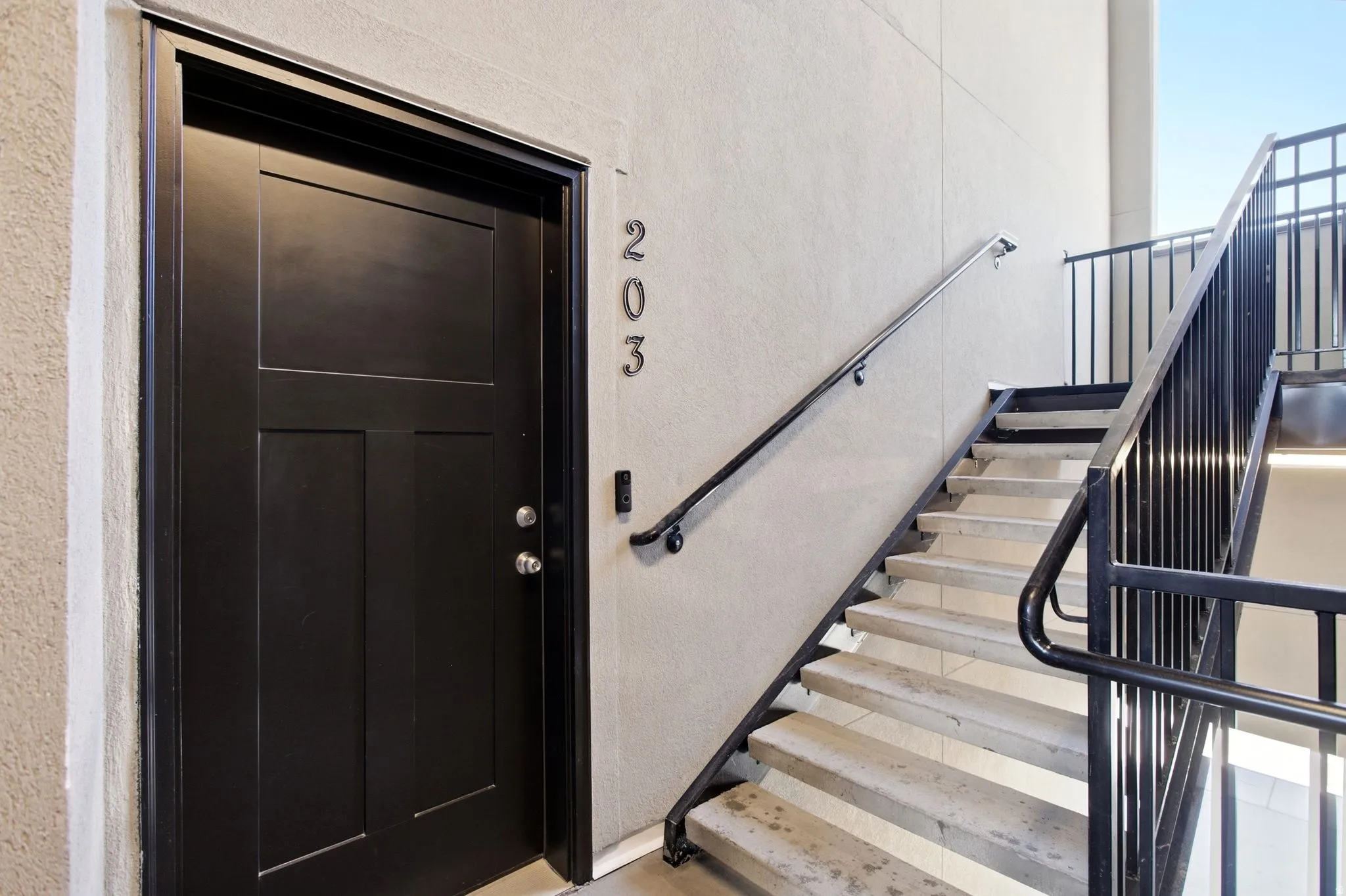 Black panel door with modern hardware