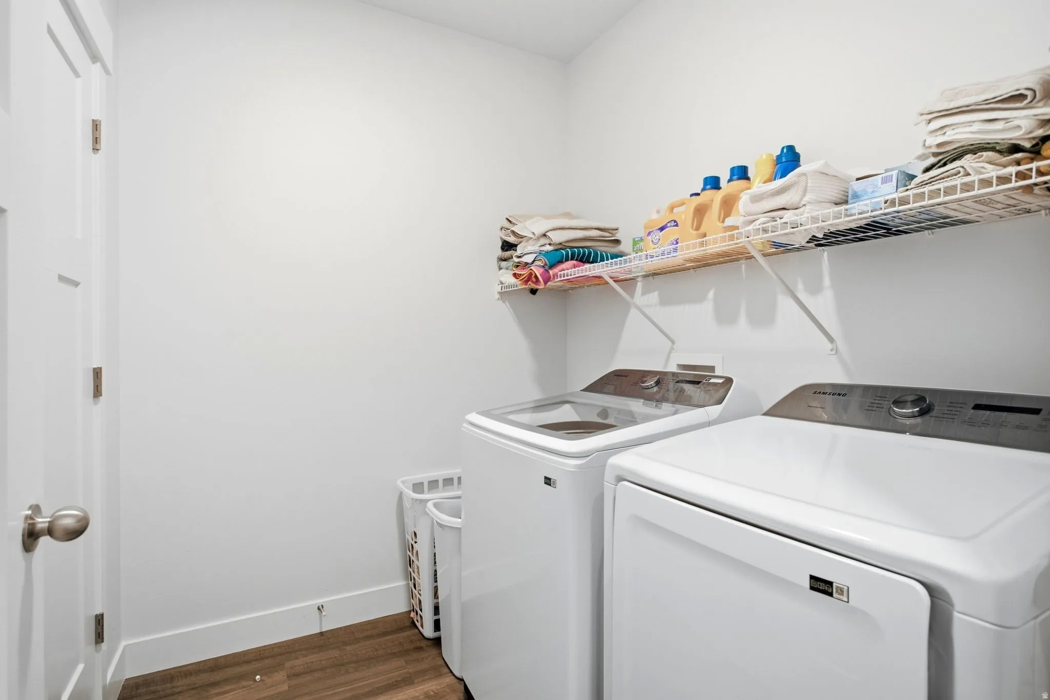 Dedicated utility space with wood-finish flooring