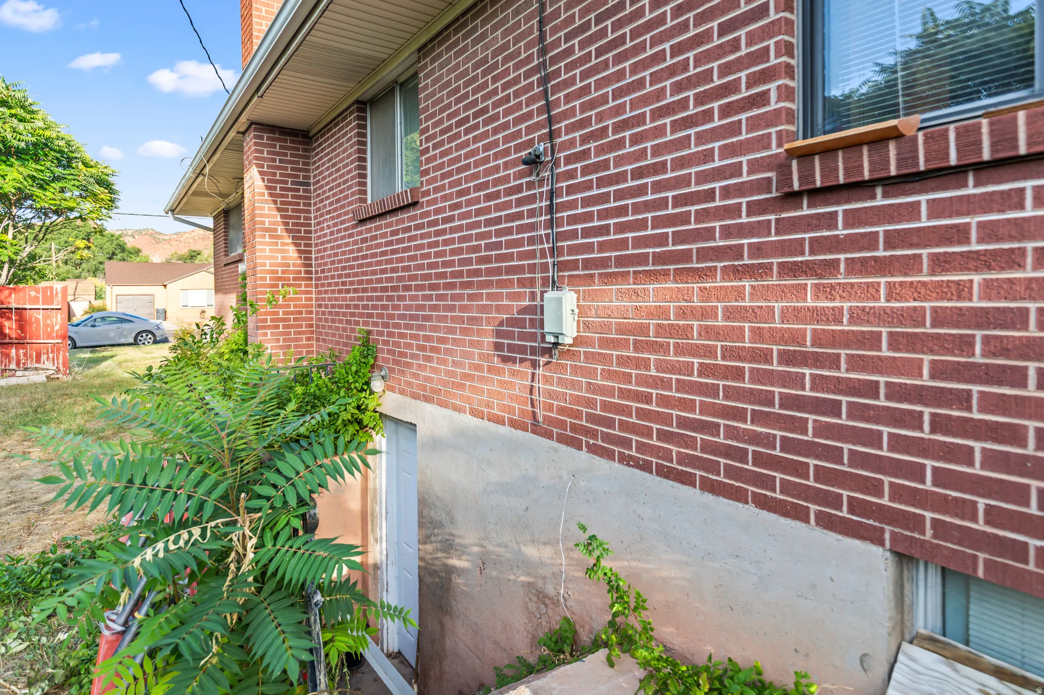 Red brick exterior with a concrete foundation
