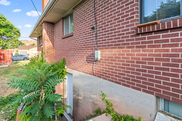 Red brick exterior with a concrete foundation