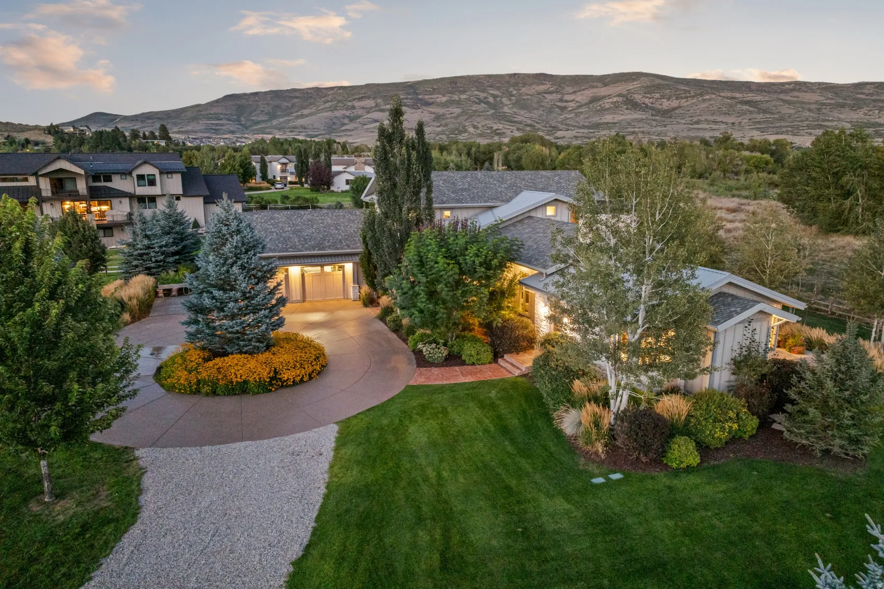 Expansive green lawn and mature trees