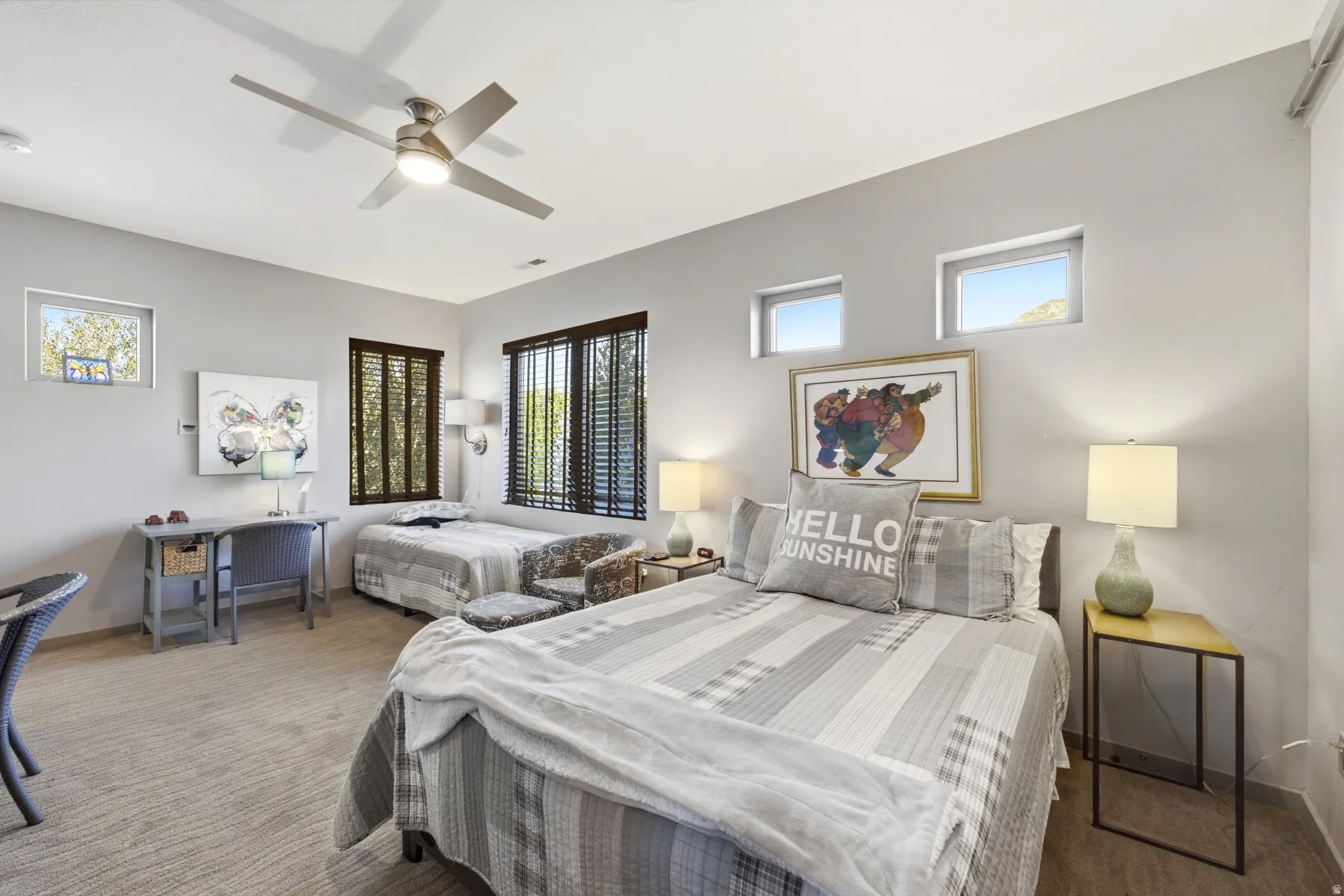 Recessed lighting, wood-finish flooring, multiple windows, and a ceiling fan with integrated light