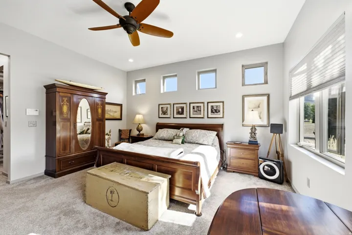 Recessed lighting, ceiling fan, and carpeted flooring