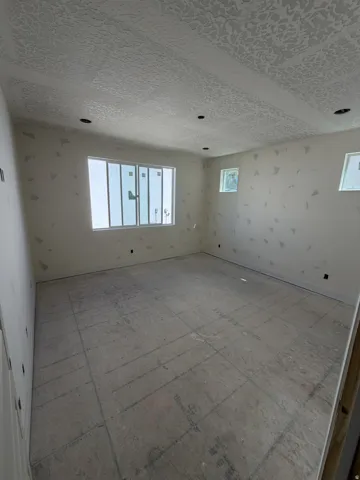 Textured ceiling with recessed lighting