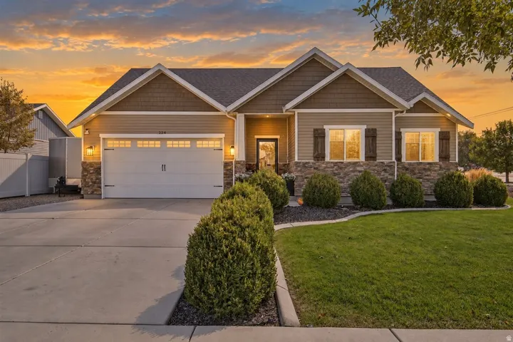 Crafted exterior featuring stone accents and horizontal siding