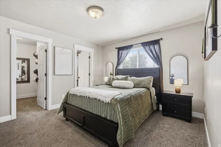 Recessed window with blinds, overhead flush mount light fixture, and broad white trim detailing