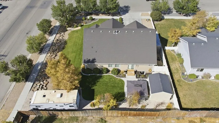 Expansive lot with mature landscaping, a private backyard, and a detached shed