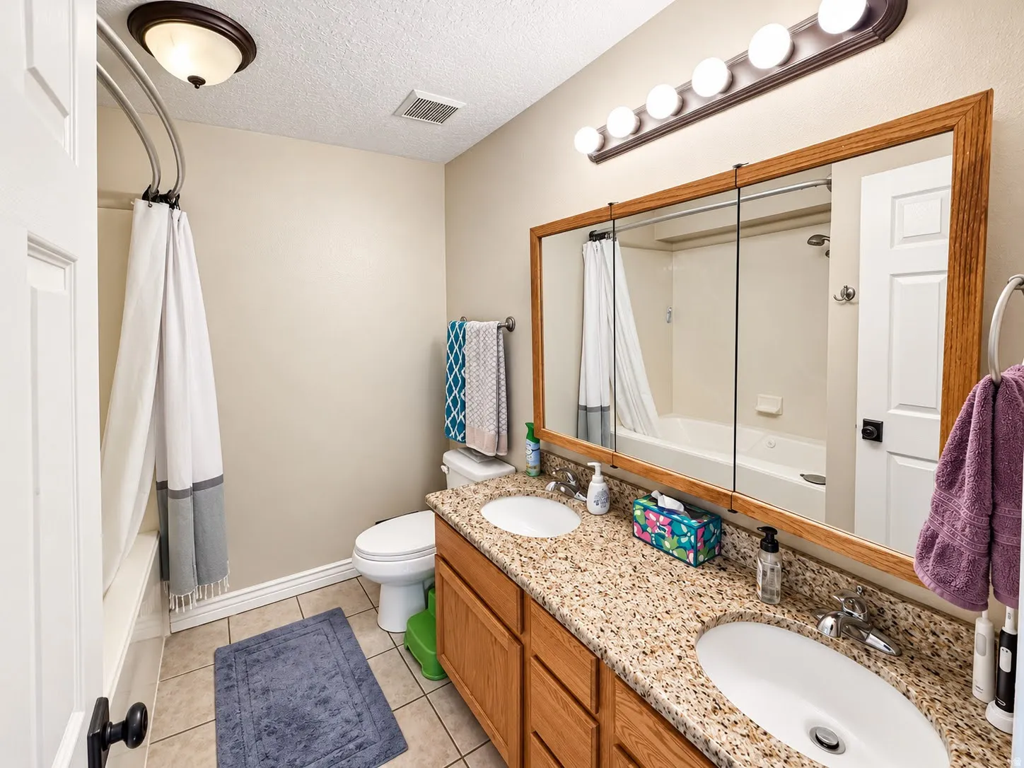 Dual vanity with stone-finish countertop