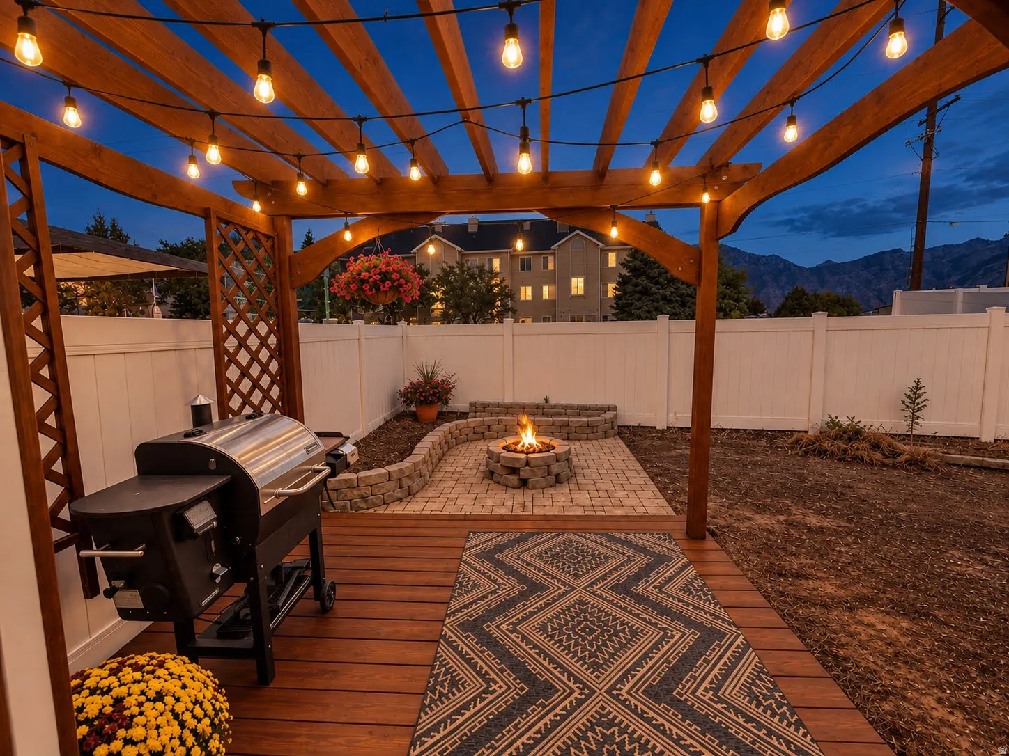 Wood-finish deck with a built-in pergola and string lighting
