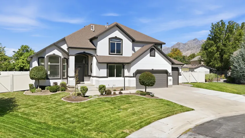 Contemporary exterior with white siding and dark trim