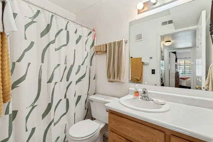 Hallway full bathroom with sink, tub and shower.