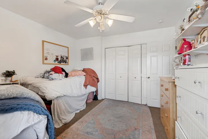 Bedroom 2, 2 twin beds, 2 dressers and closet area.