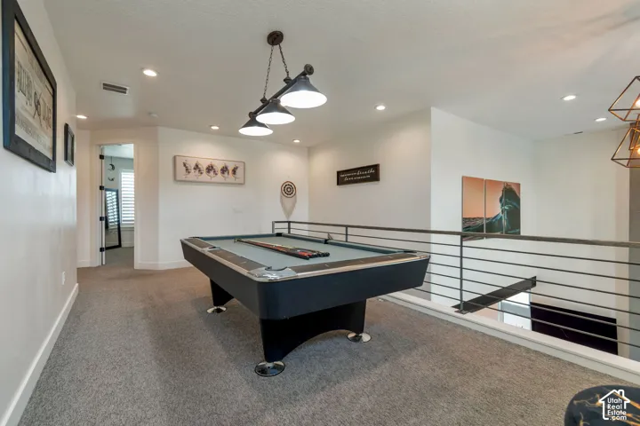 Upper-level loft with recessed lighting