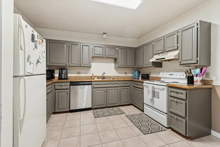 Kitchen with granite counter tops.