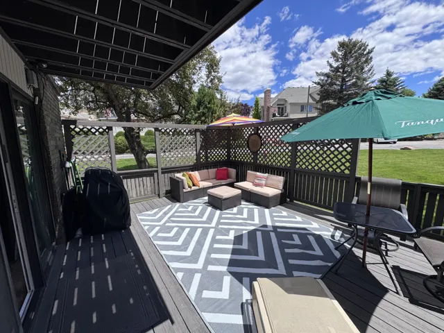 Expansive composite deck featuring a slatted privacy fence