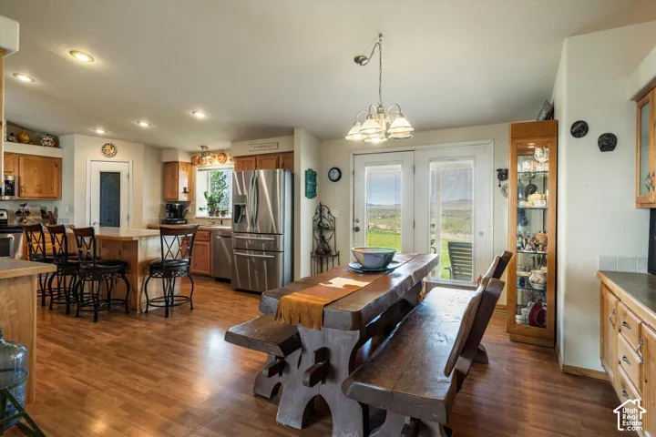 Wood-finish flooring throughout the open-concept kitchen and dining area