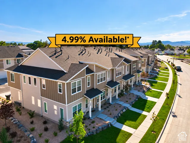 Townhome exteriors with vertical and horizontal siding, gabled rooflines, and stone accents