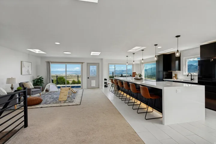 Spacious open-concept living area with multiple skylights