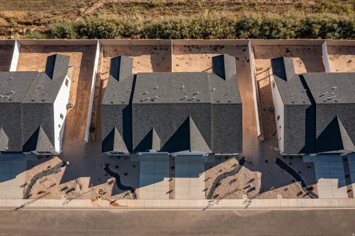Contemporary rooftops featuring dark shingle material