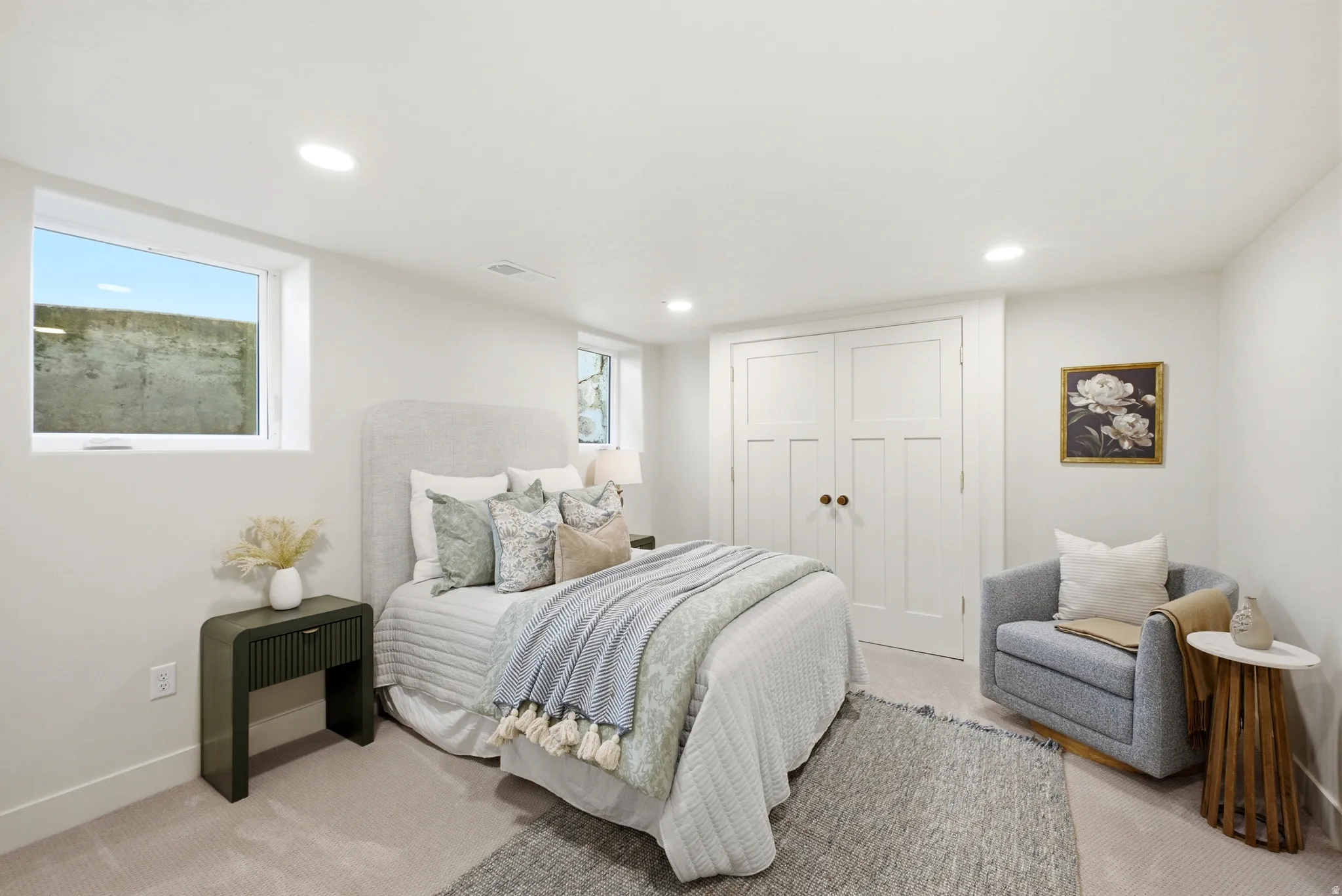 Recessed lighting illuminating the carpeted flooring