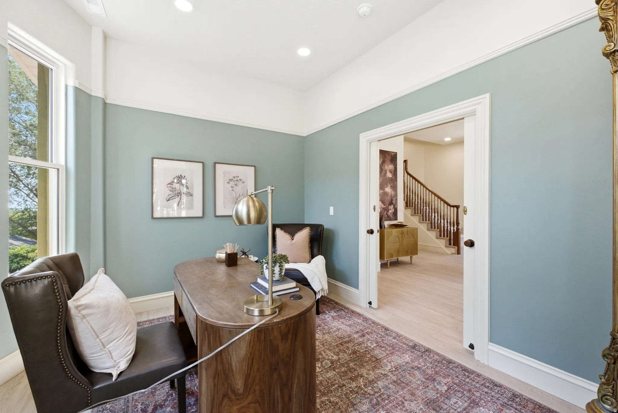 Recessed lighting, wood-finish flooring, and crown molding