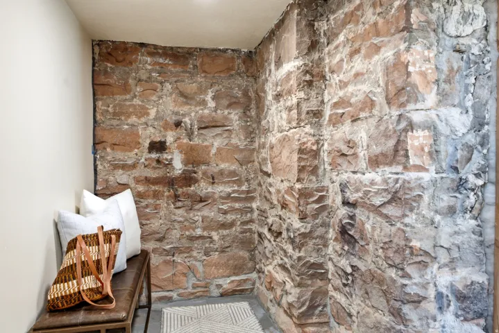 Exposed stone wall with varying earth tones