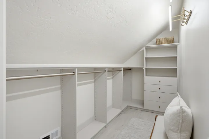 Custom built-in closet system with shelving and hanging rods