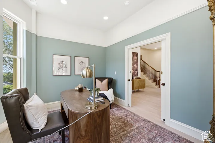 Recessed lighting, wood-finish flooring, and crown molding