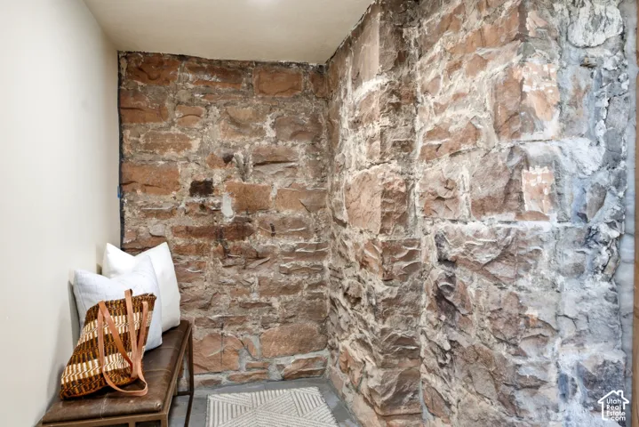 Exposed stone wall with varying earth tones