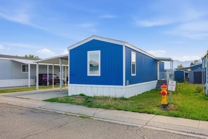 Blue exterior siding with white trim