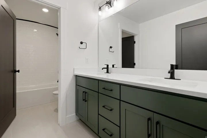 Dual vanity with white countertop and integrated sinks