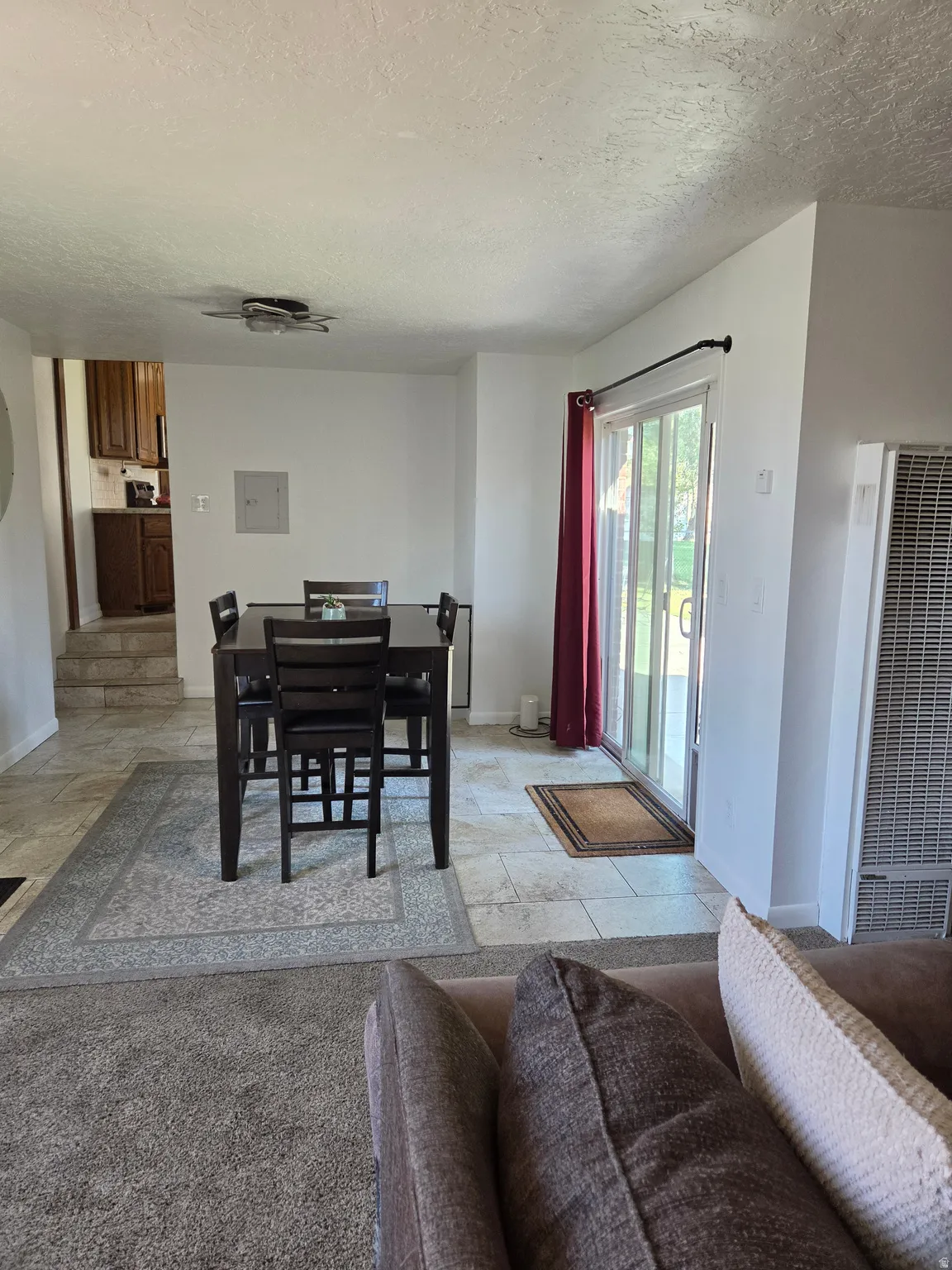 Dining area with sliding glass door that goes to the back yard.