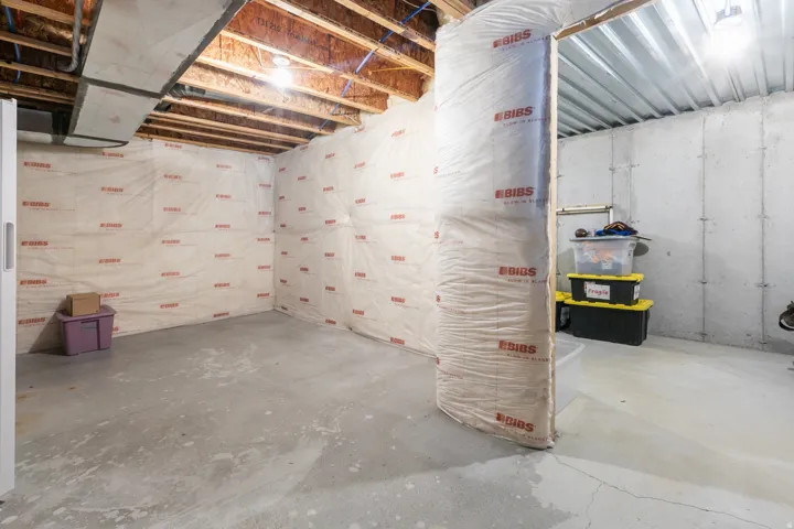 Concrete flooring with exposed ceiling joists and ductwork