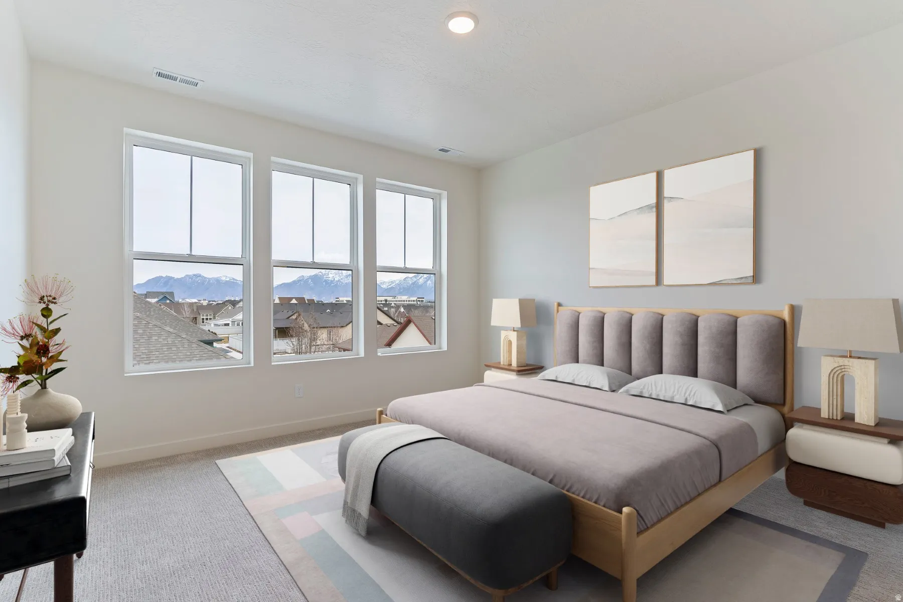 Three large windows illuminate the space, complementing the light-toned walls and neutral carpeting