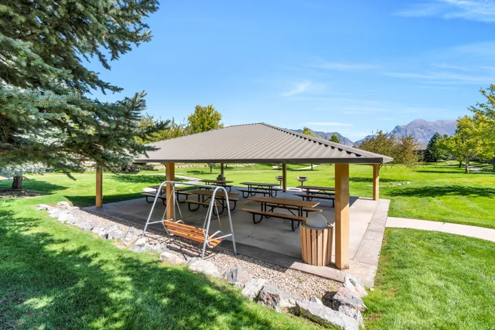 Open-air pavilion with a metal roof and concrete flooring