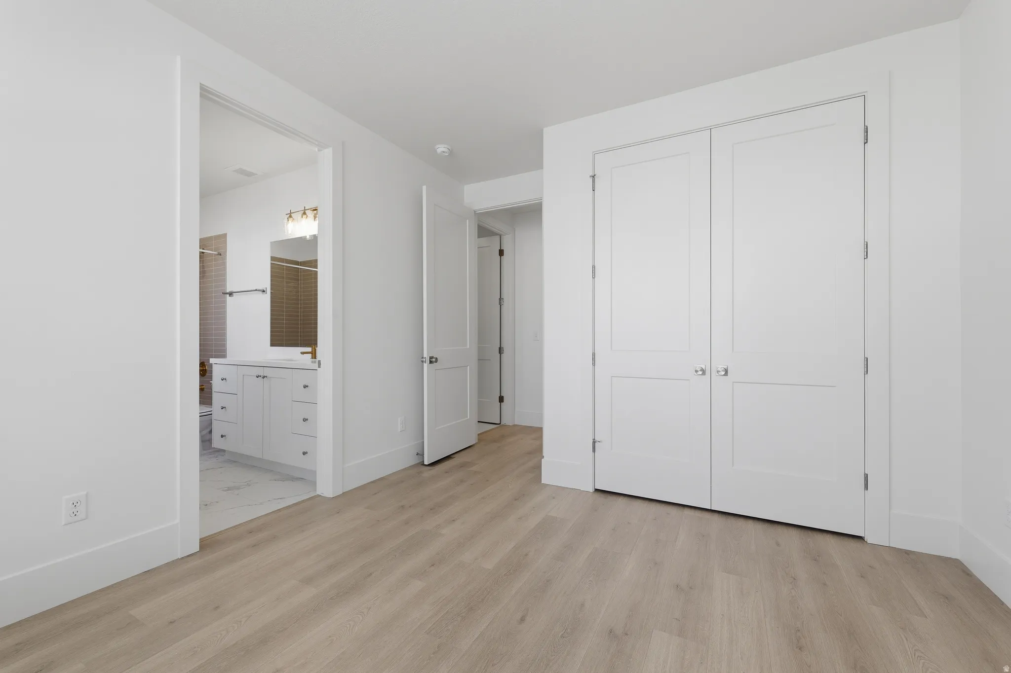 level one guest bedroom with ensuite bathroom.