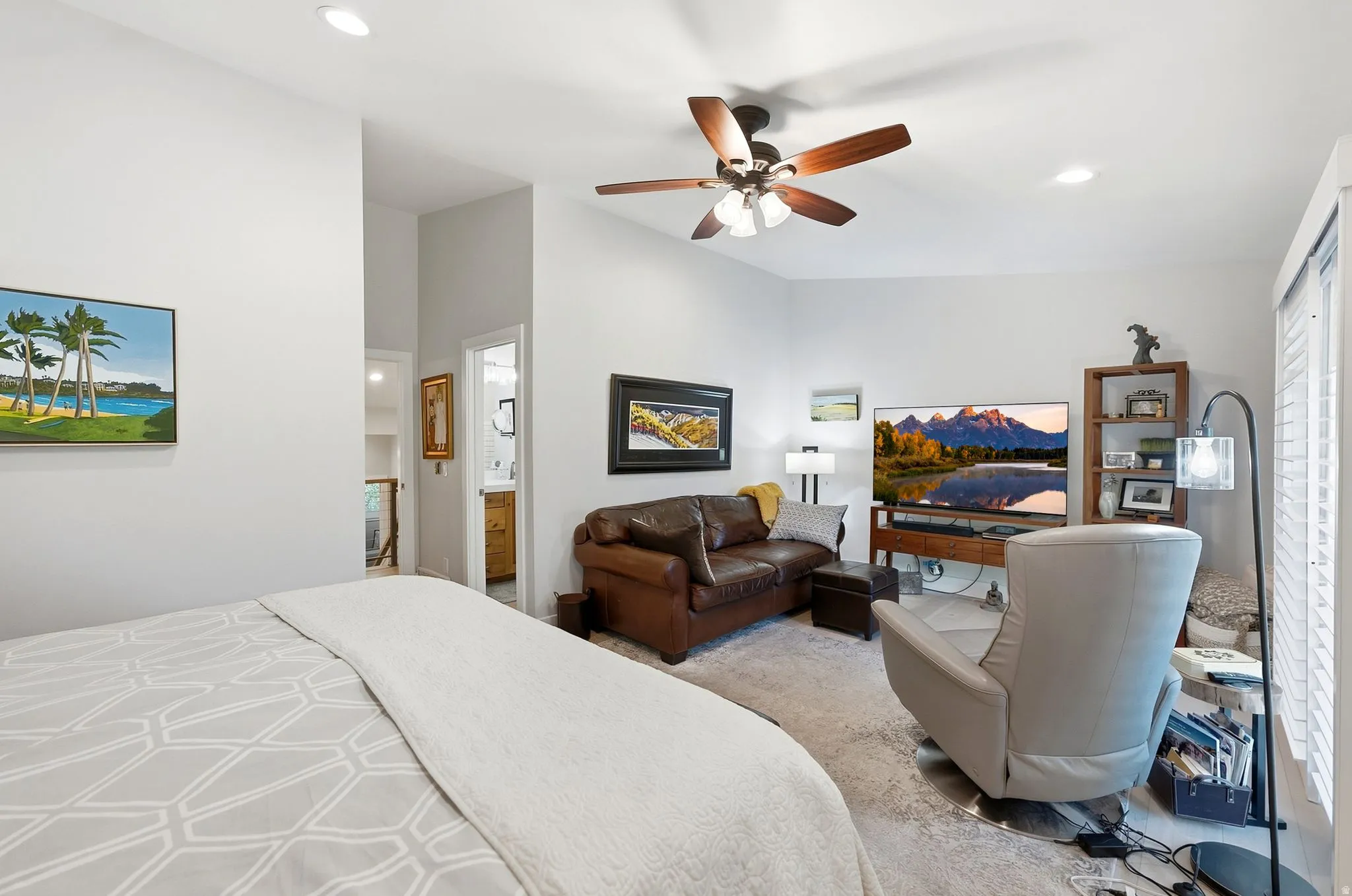 Vaulted ceilings, recessed lighting, ceiling fan with integrated light, and window with blinds
