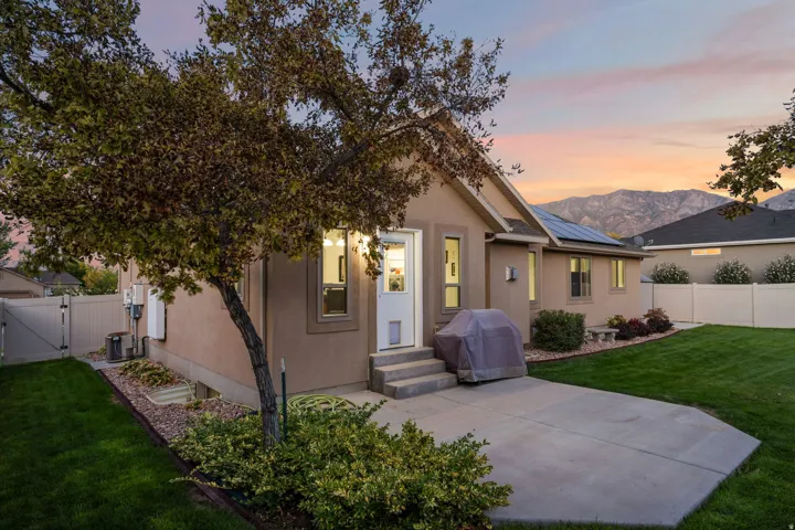 Expansive lawn with mature trees and established landscaping