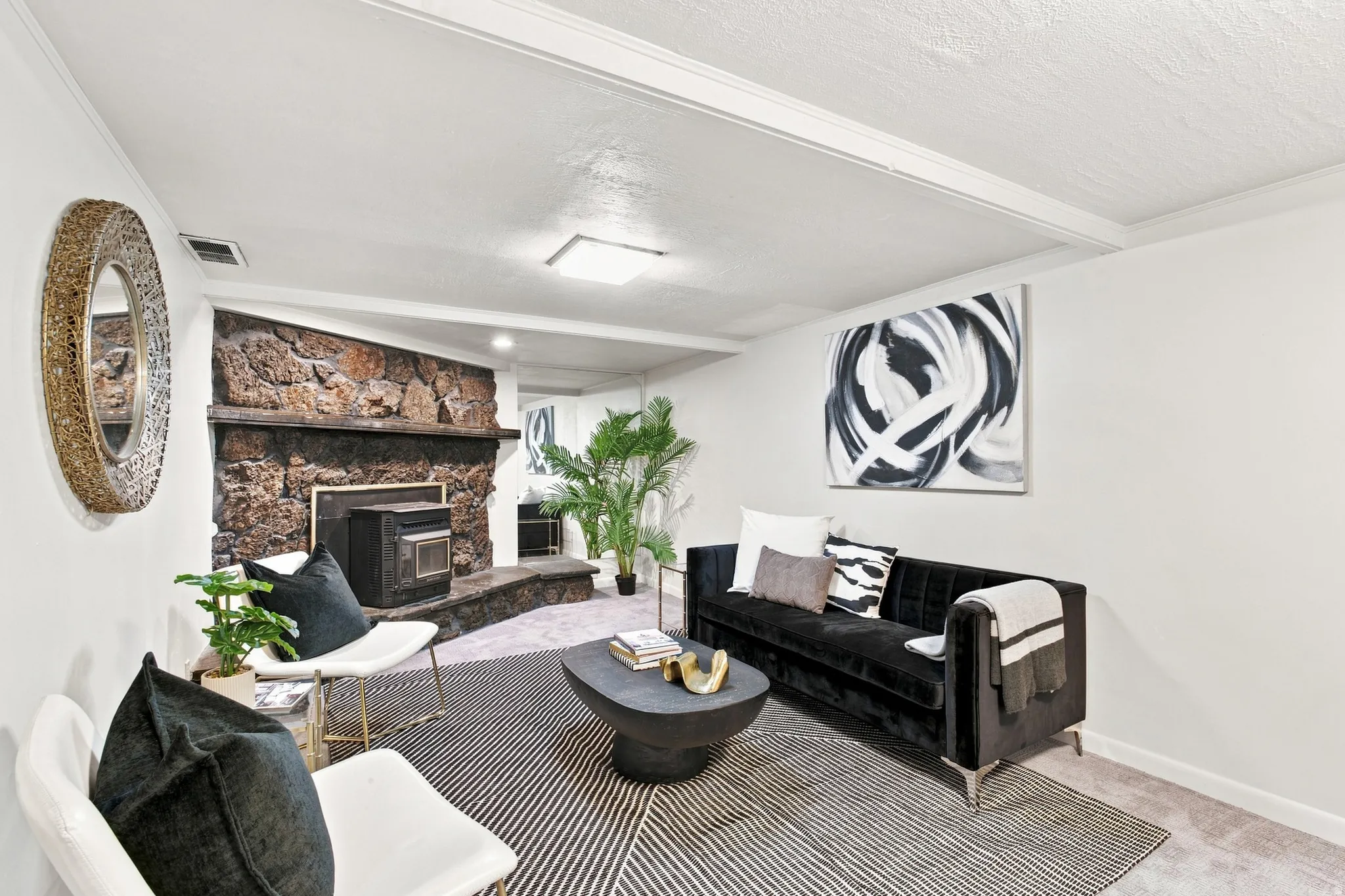 Stone accent wall with built-in fireplace unit