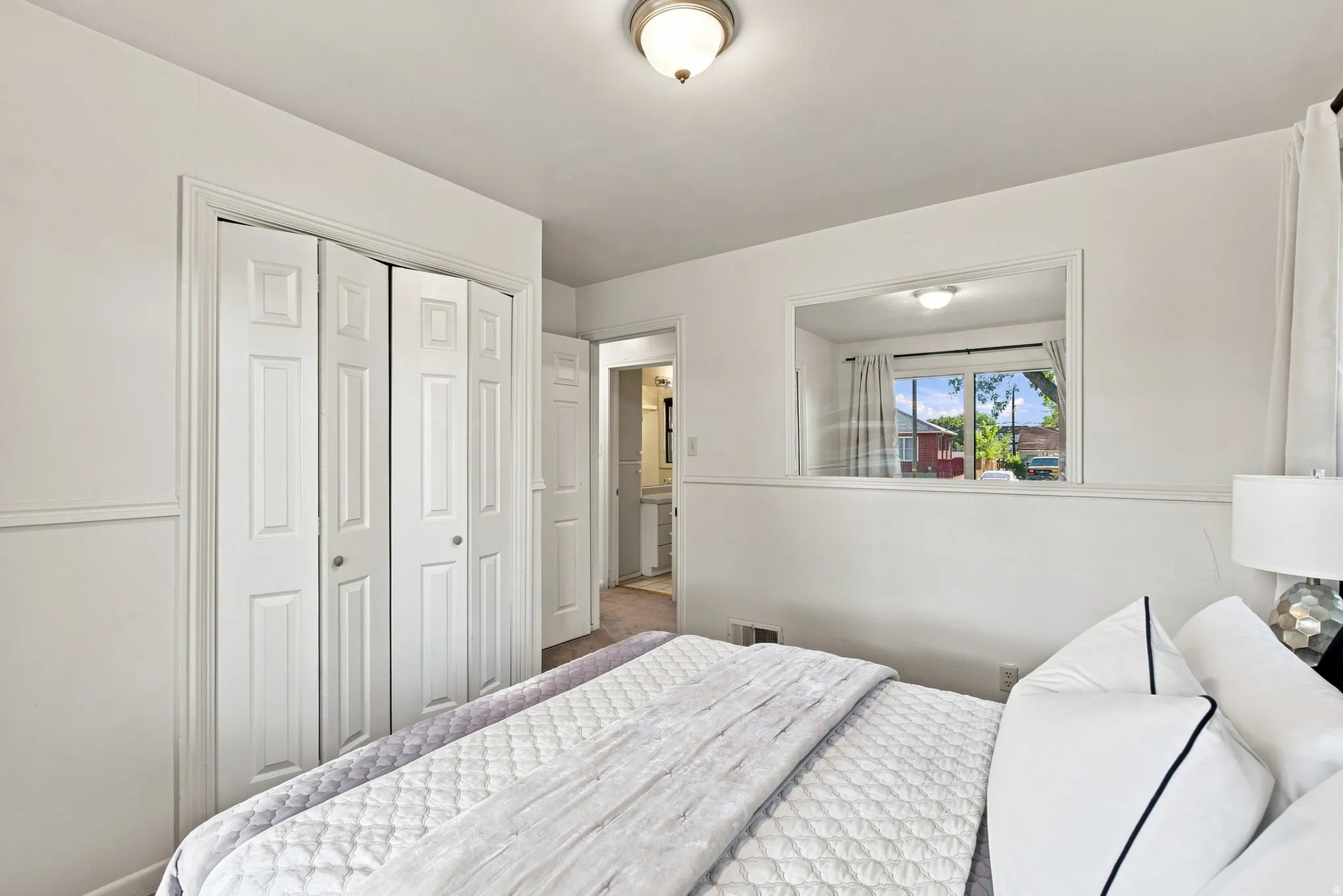 White paneled bi-fold closet doors