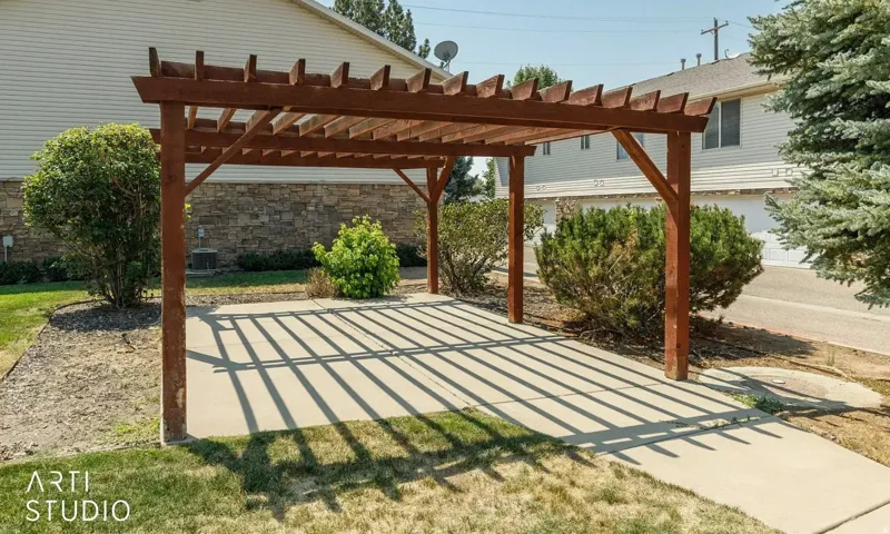 Wood pergola structure with a concrete patio