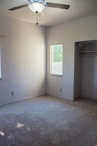 Open closet space with shelf and integrated hanging rod