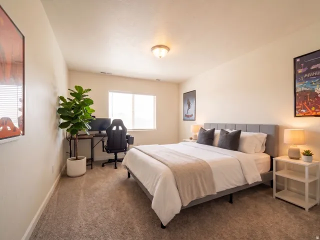 Wall-to-wall carpeting, recessed window, and flush mount lighting