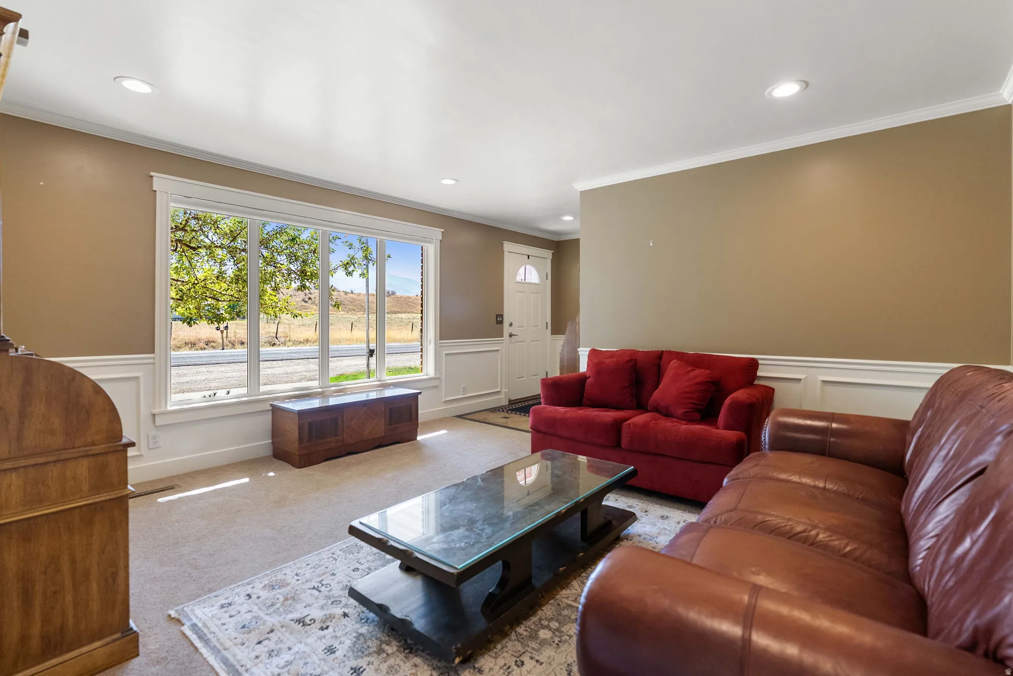 Recessed lighting, crown molding, and wainscoting details