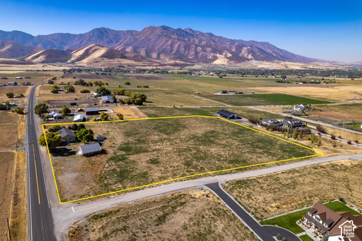 Expansive lot featuring a primary residence, a secondary detached structure, and established surrounding roads