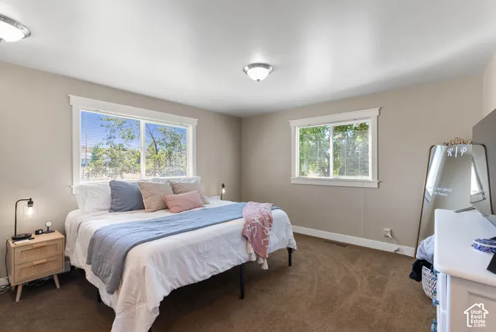 Neutral-toned walls complement carpeted flooring and white trim