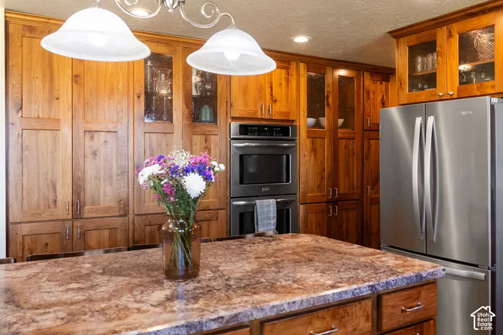 Expansive kitchen island with a stone countertop